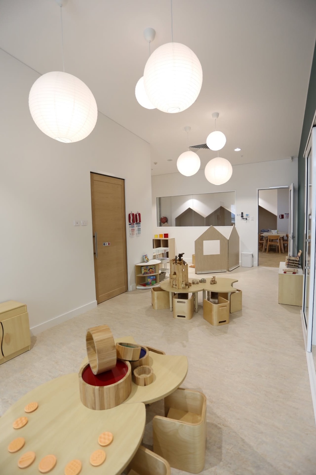 A calm room with wooden blocks and natural play materials